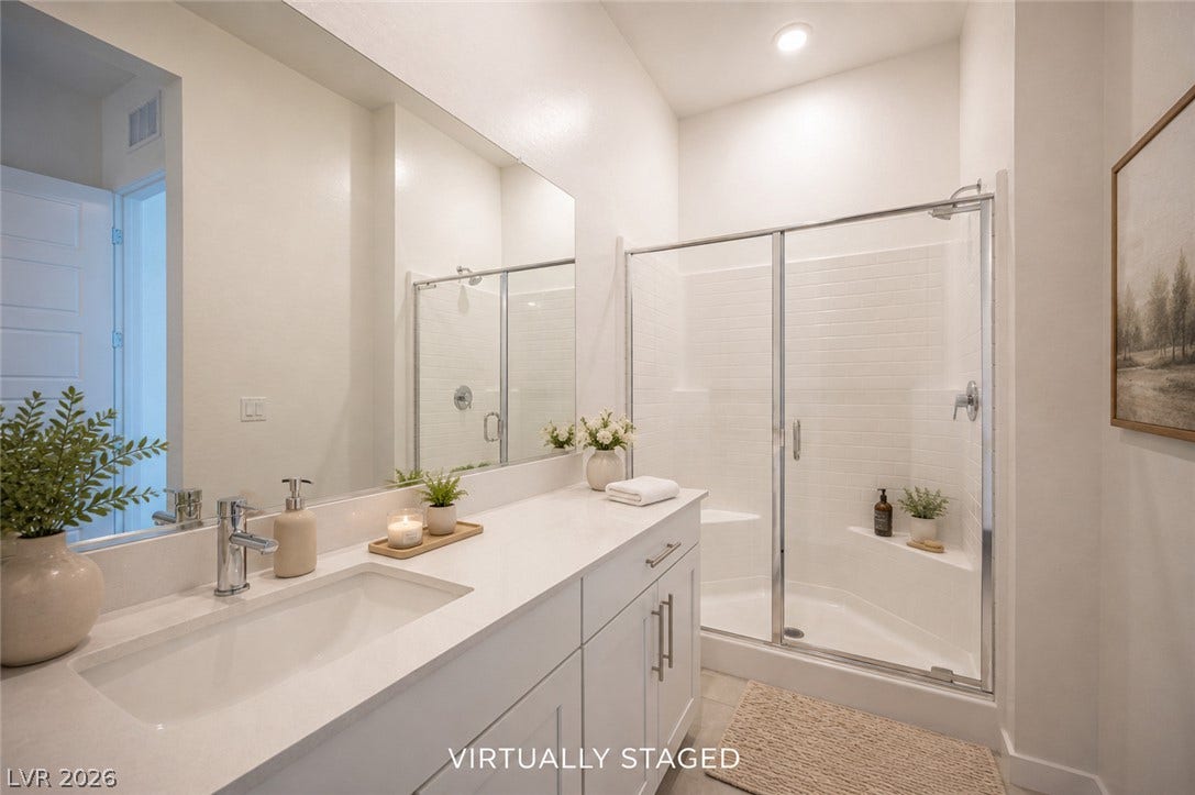 3904 Aiden Creek Avenue, North Las Vegas, NV 89031 Clean lines and a spacious walk-in shower define this modern bathroom space.