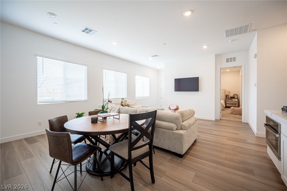 3904 Aiden Creek Avenue, North Las Vegas, NV 89031 Clean lines and smooth flooring define this light-filled, open-concept living and dining space.