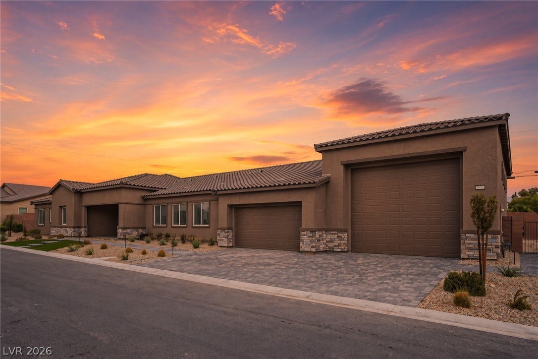 3904 Aiden Creek Avenue, North Las Vegas, NV 89031 Stone accents and a paved driveway complement this modern single-story complete with RV Garage