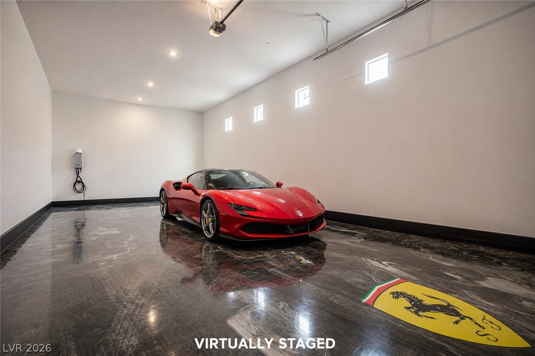 3904 Aiden Creek Avenue, North Las Vegas, NV 89031 Gleaming custom floors and recessed lighting define this pristine multi-vehicle garage space.
