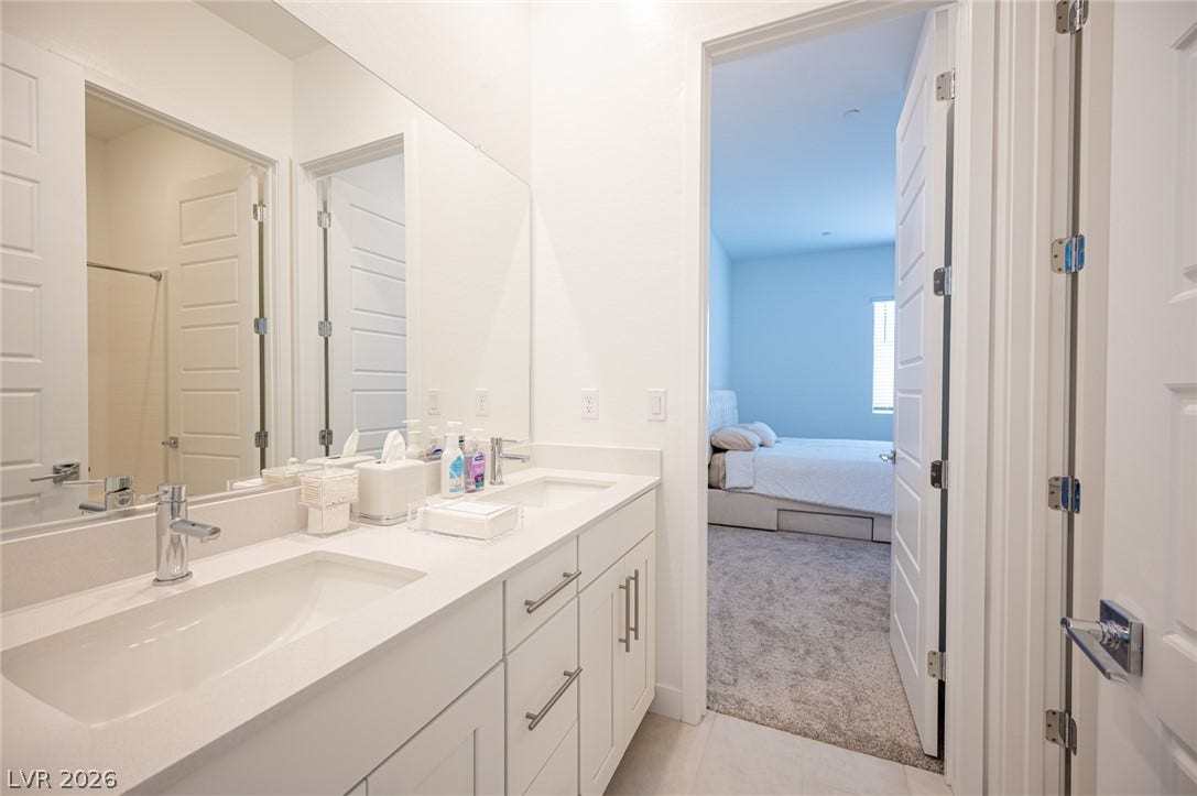 3904 Aiden Creek Avenue, North Las Vegas, NV 89031 Clean lines and a spacious dual vanity define this modern bathroom design.