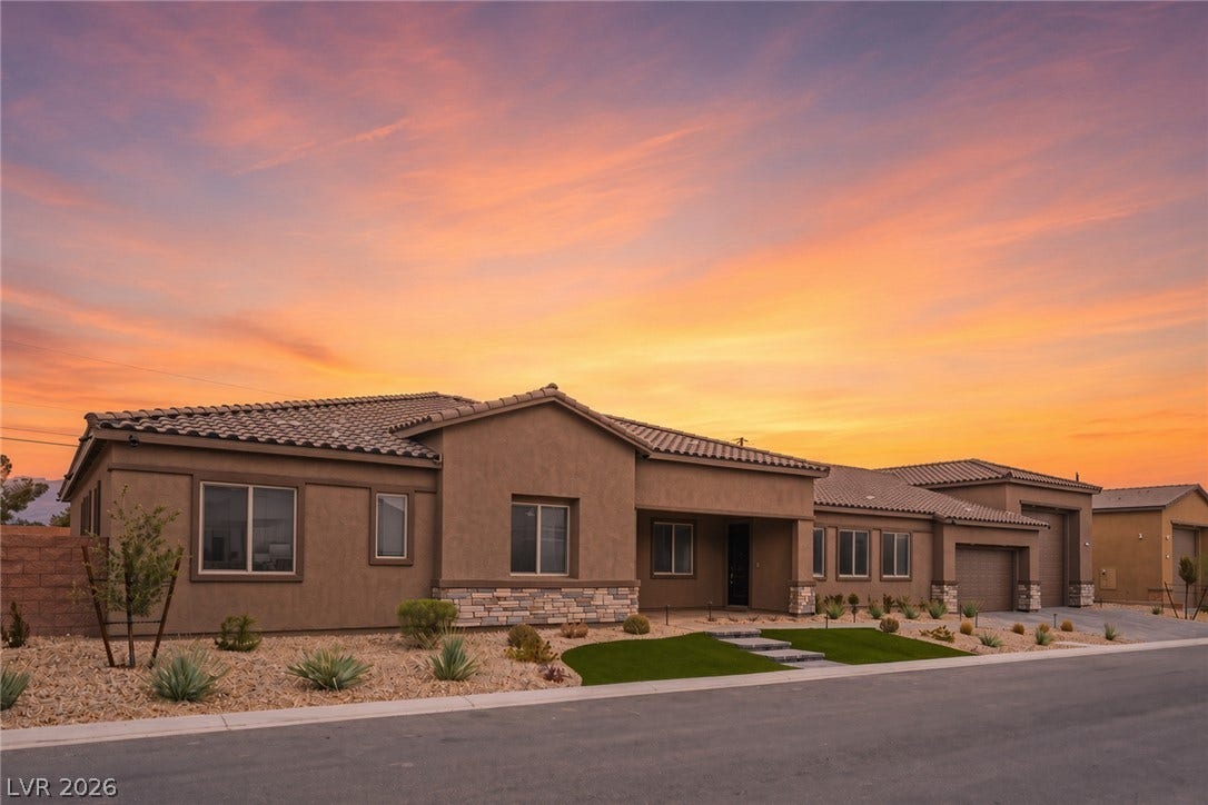 3904 Aiden Creek Avenue, North Las Vegas, NV 89031 Earth-toned stone accents and a tiled roof define this modern desert facade.