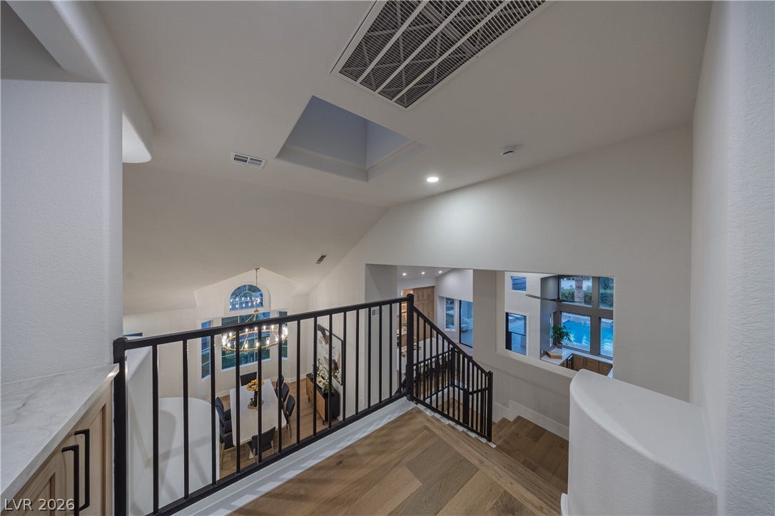 8800 Lusso Court, Las Vegas, NV 89134 Stairs featuring wood finished floors and recessed lighting