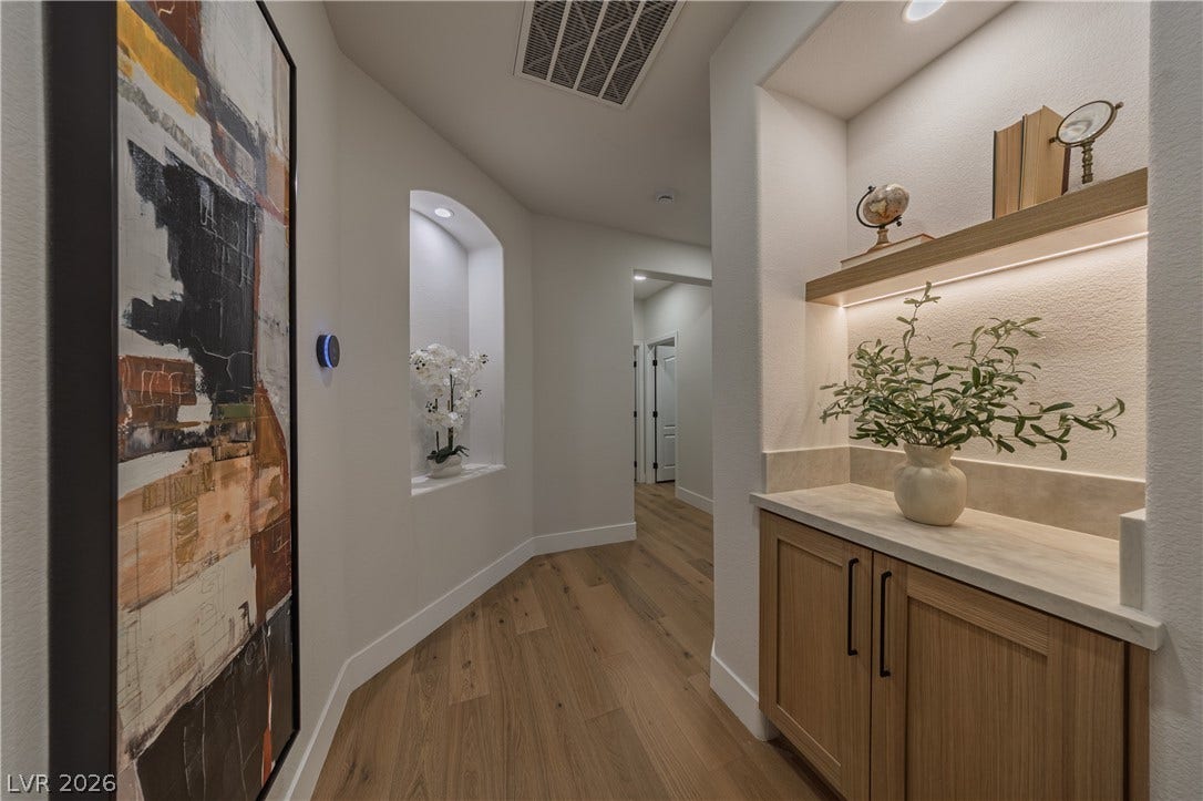 8800 Lusso Court, Las Vegas, NV 89134 Hallway with light wood-style floors and baseboards