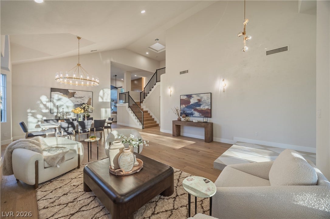 8800 Lusso Court, Las Vegas, NV 89134 Living area with suspended lighting, light wood-style floors, and lofted ceiling