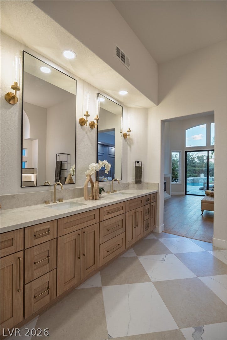 8800 Lusso Court, Las Vegas, NV 89134 Full bathroom featuring double vanity, recessed lighting, and a high ceiling