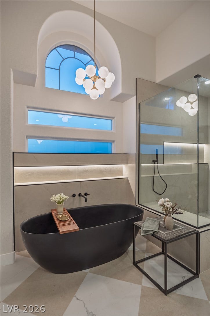 8800 Lusso Court, Las Vegas, NV 89134 Full bathroom with a freestanding tub, walk in shower, and suspended lighting