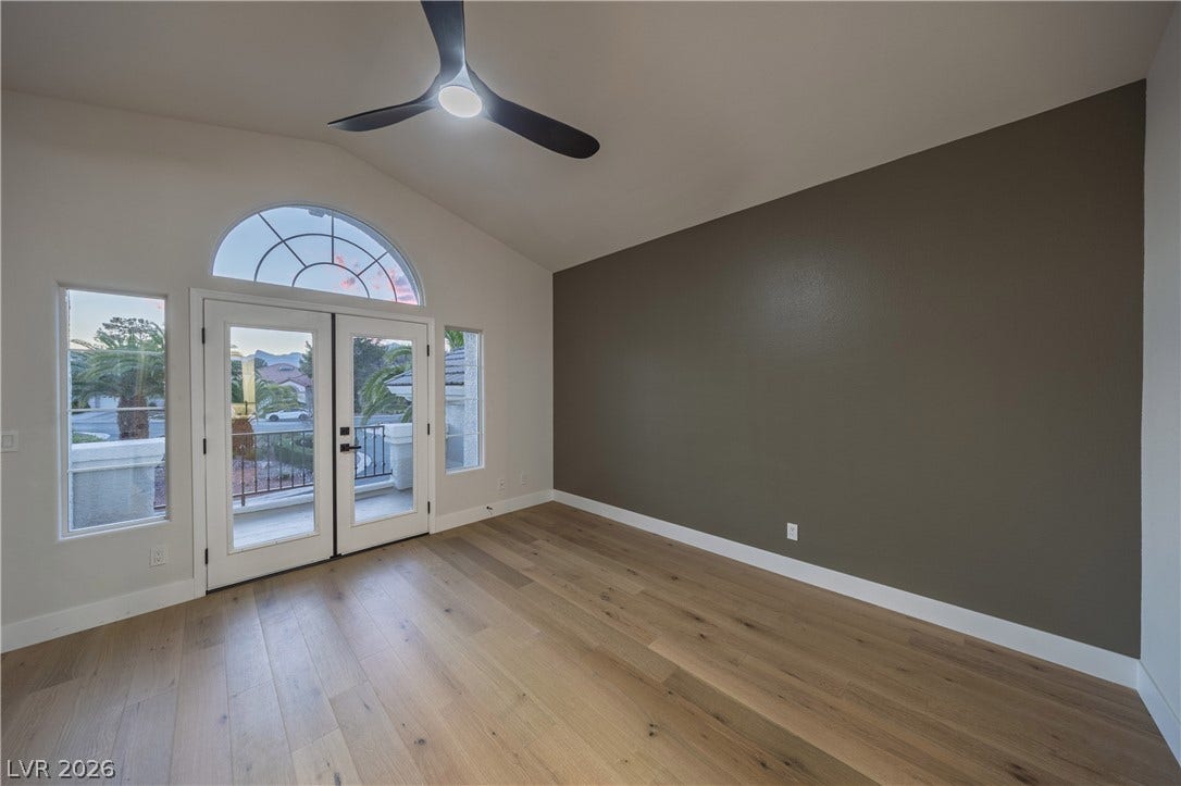 8800 Lusso Court, Las Vegas, NV 89134 Doorway to outside with french doors, ceiling fan, hardwood / wood-style floors, and lofted ceiling
