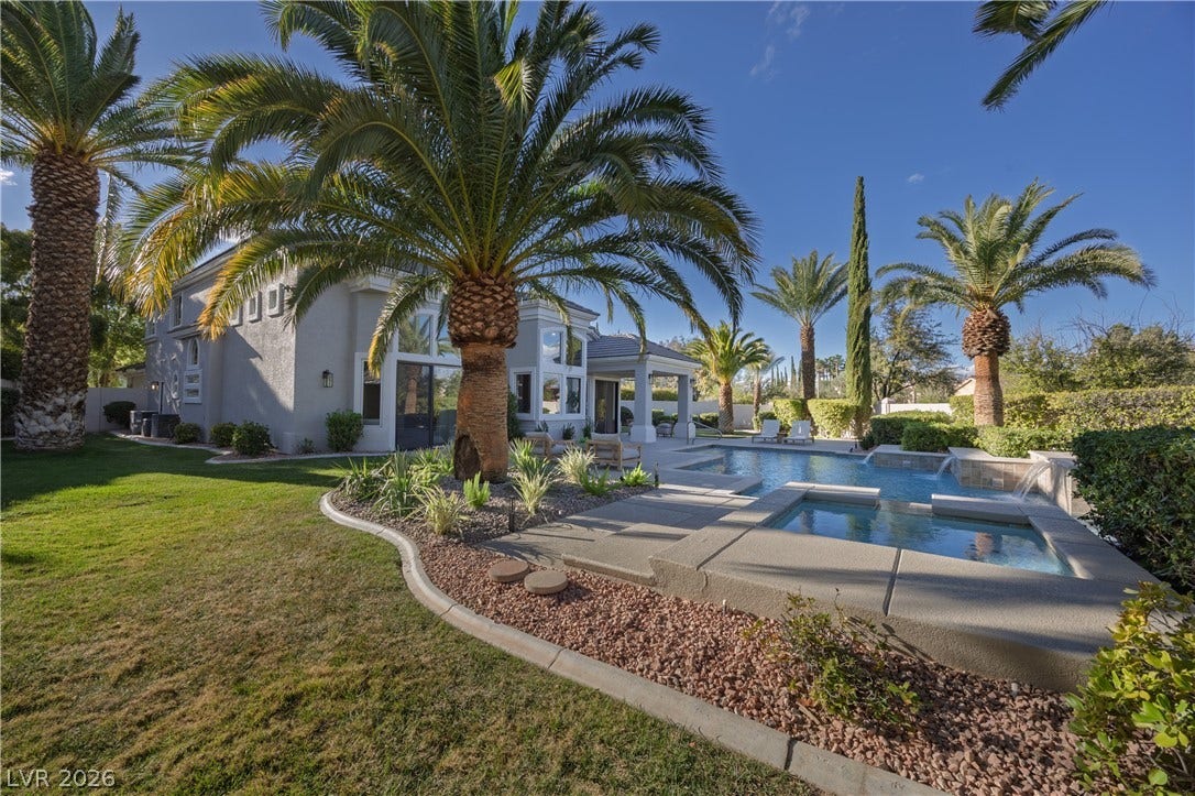 8800 Lusso Court, Las Vegas, NV 89134 Combined pool / hot tub with a patio and a lawn