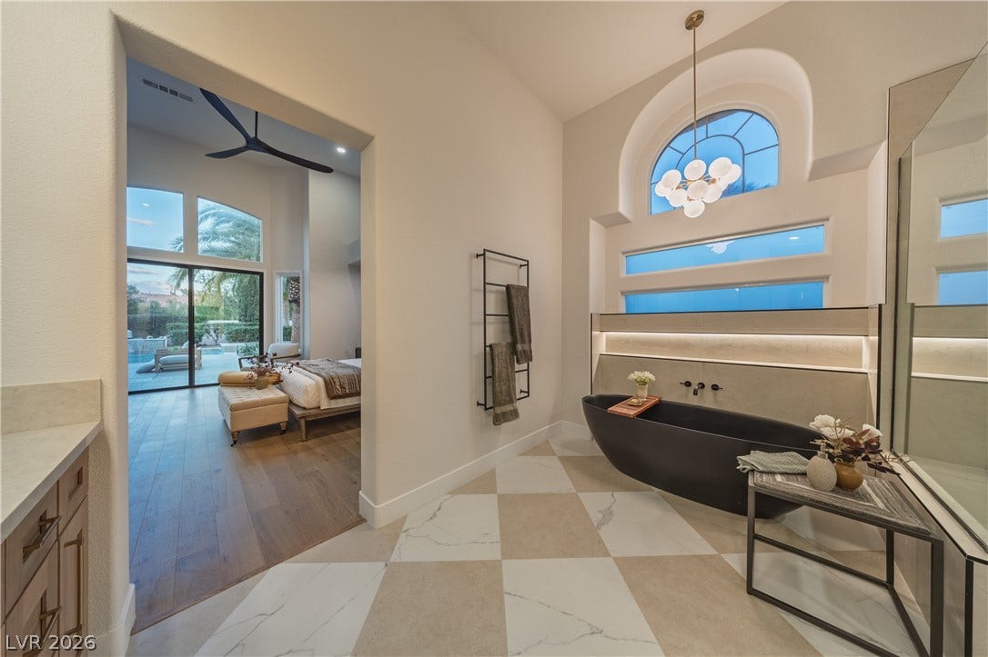 8800 Lusso Court, Las Vegas, NV 89134 Bathroom with ensuite bath, a soaking tub, a high ceiling, and vanity