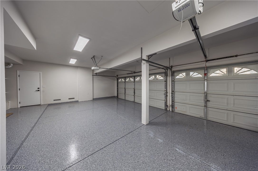 8800 Lusso Court, Las Vegas, NV 89134 Garage featuring a garage door opener