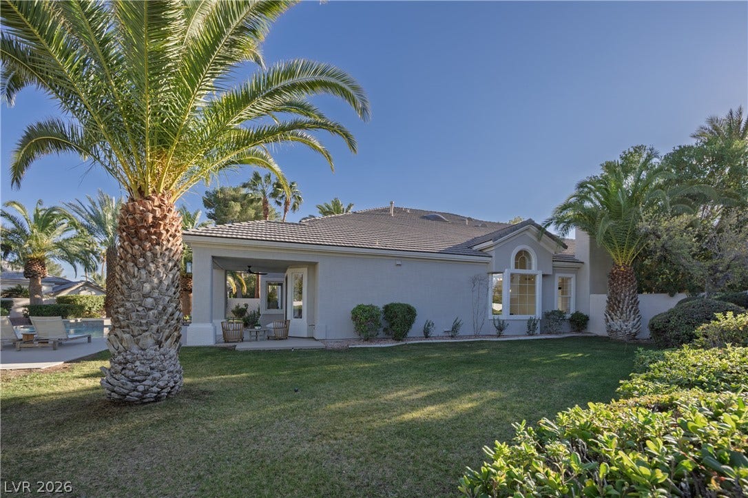 8800 Lusso Court, Las Vegas, NV 89134 View of front of property featuring stucco siding, a front yard, a tiled roof, and a patio area