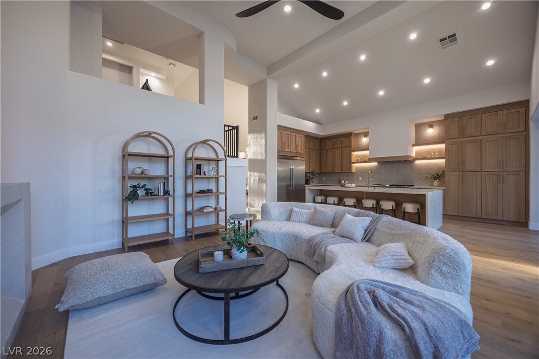 8800 Lusso Court, Las Vegas, NV 89134 Living room with vaulted ceiling, ceiling fan, light wood-style floors, and recessed lighting