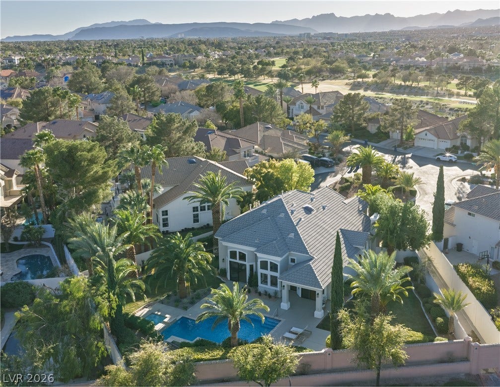 8800 Lusso Court, Las Vegas, NV 89134 Aerial perspective of suburban area featuring a mountain backdrop