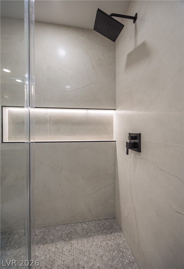 8800 Lusso Court, Las Vegas, NV 89134 Bathroom featuring a marble finish shower