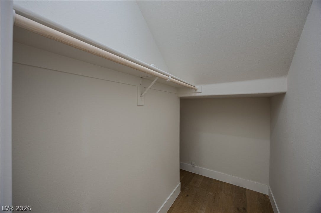 8800 Lusso Court, Las Vegas, NV 89134 Walk in closet with light wood finished floors