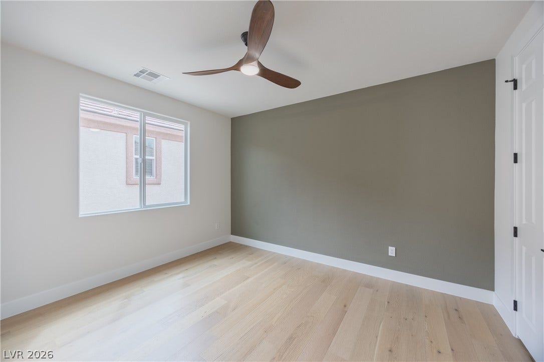 Unfurnished room with light wood-type flooring and a ceiling fan