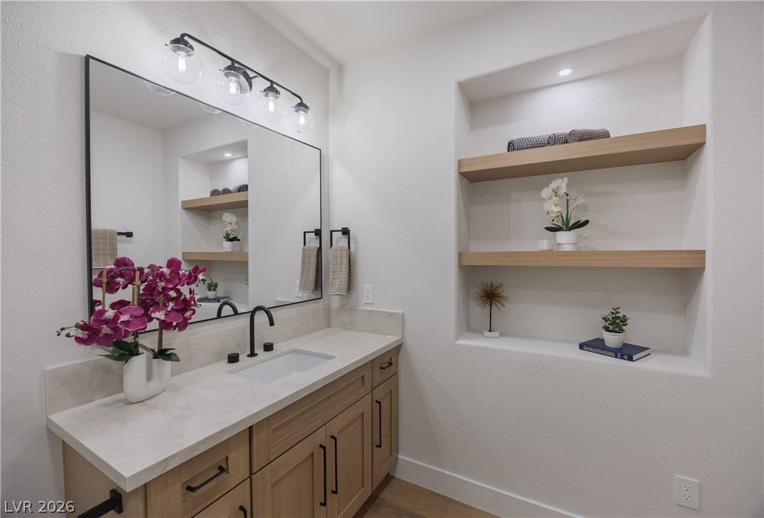 Bathroom featuring vanity and built in features