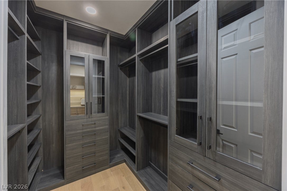 Walk in closet featuring light wood-type flooring