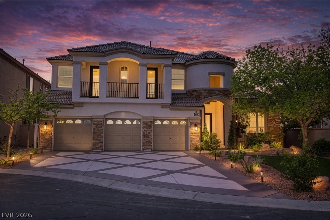 Mediterranean / spanish-style house with a balcony, stucco siding, a garage, a tile roof, and concrete driveway