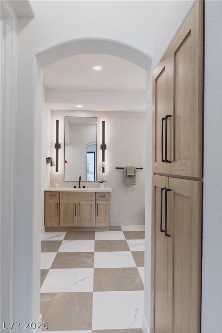 Bathroom featuring vanity and recessed lighting