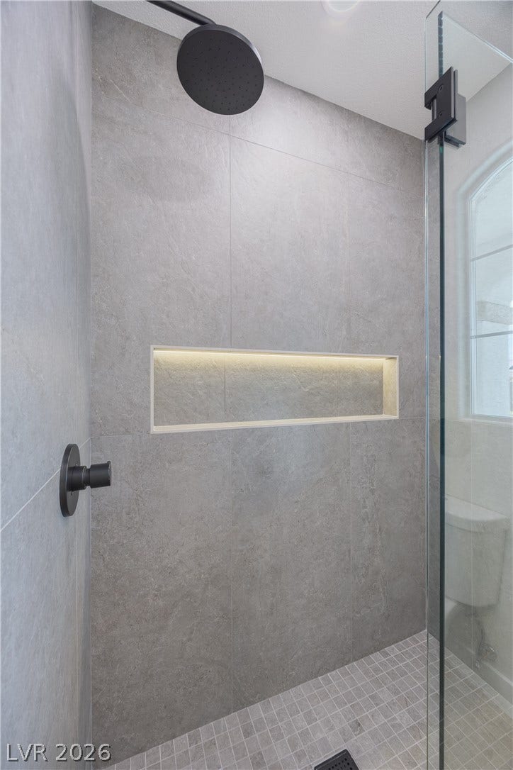 Bathroom featuring a shower stall