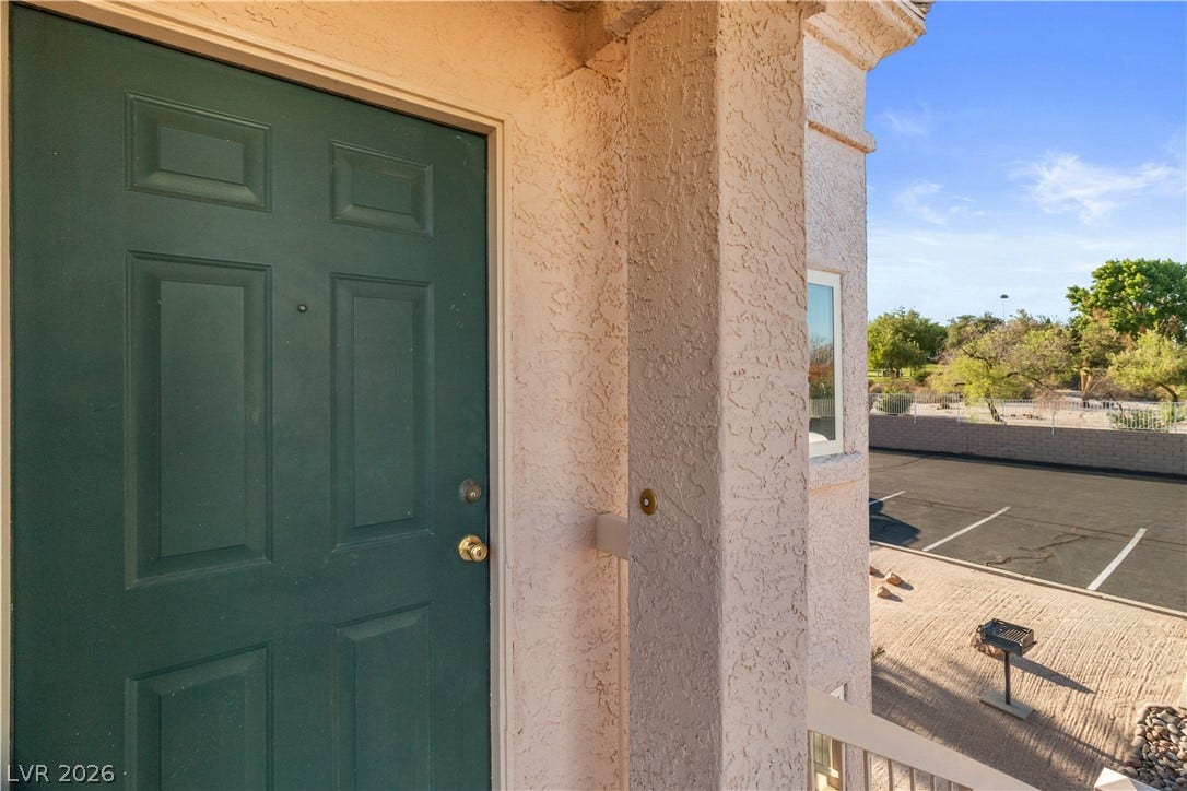 View of exterior entry featuring stucco siding