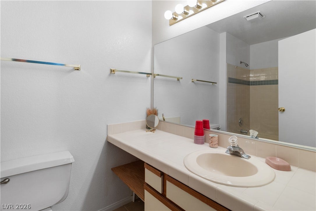 Ensuite Primary Bathroom with toilet and vanity