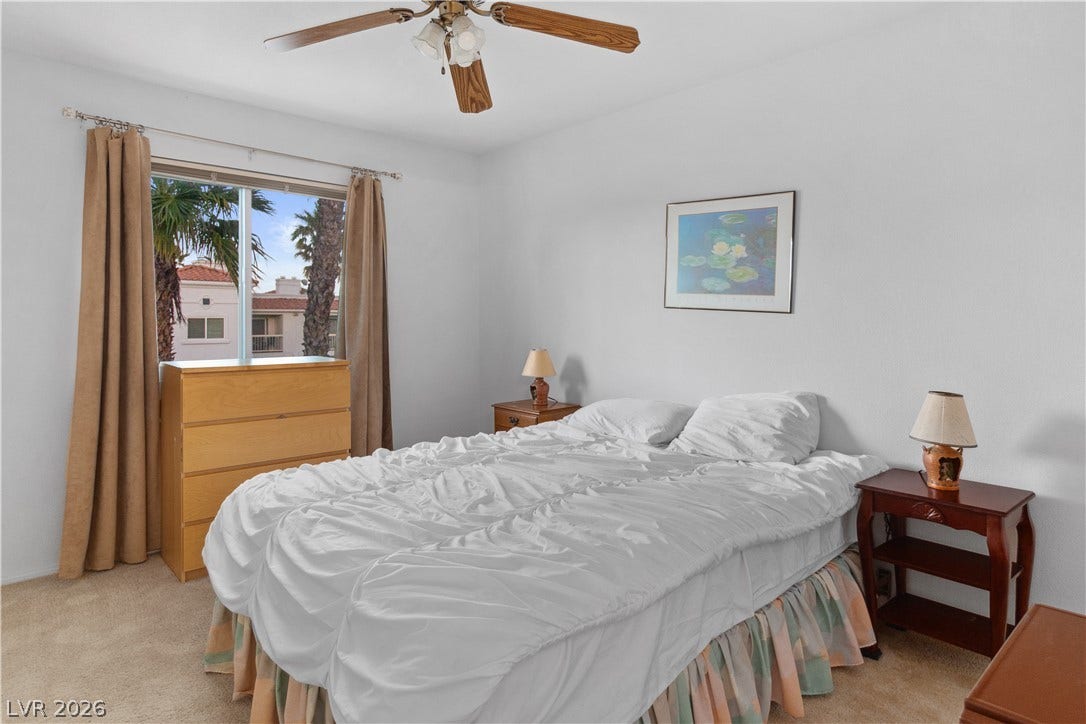 Third Bedroom featuring light colored carpet and ceiling fan