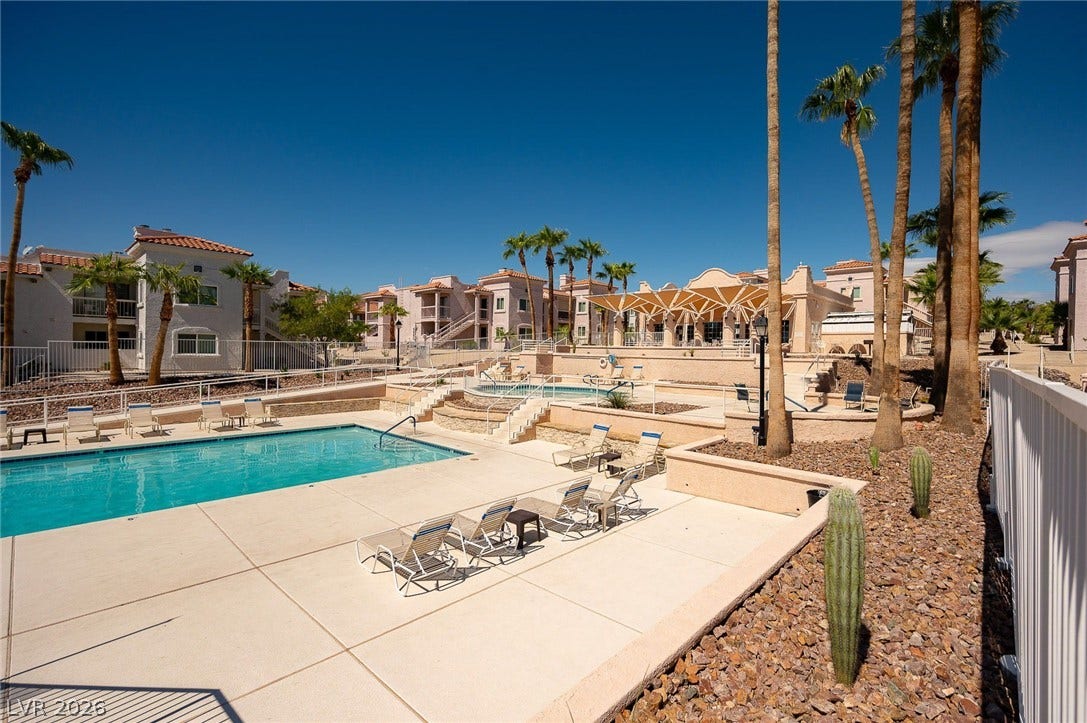 Community pool featuring a residential view and a patio area