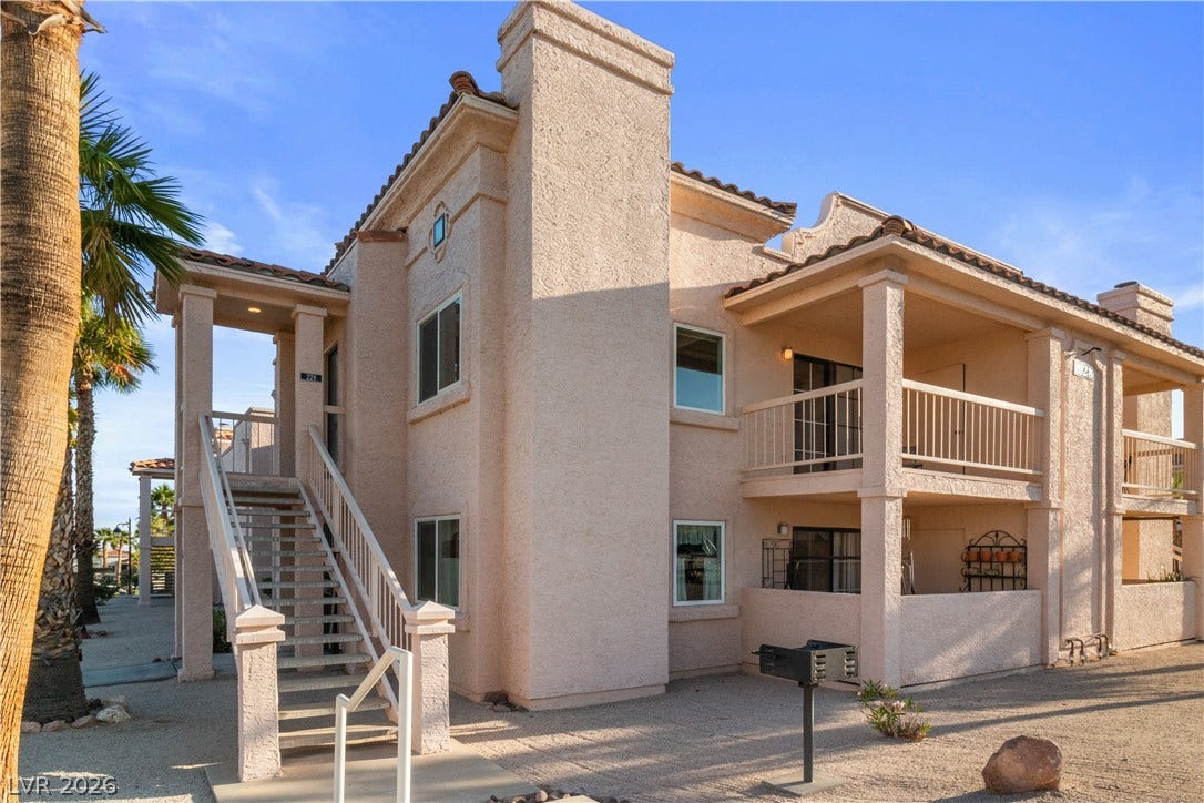 View of property featuring stairway