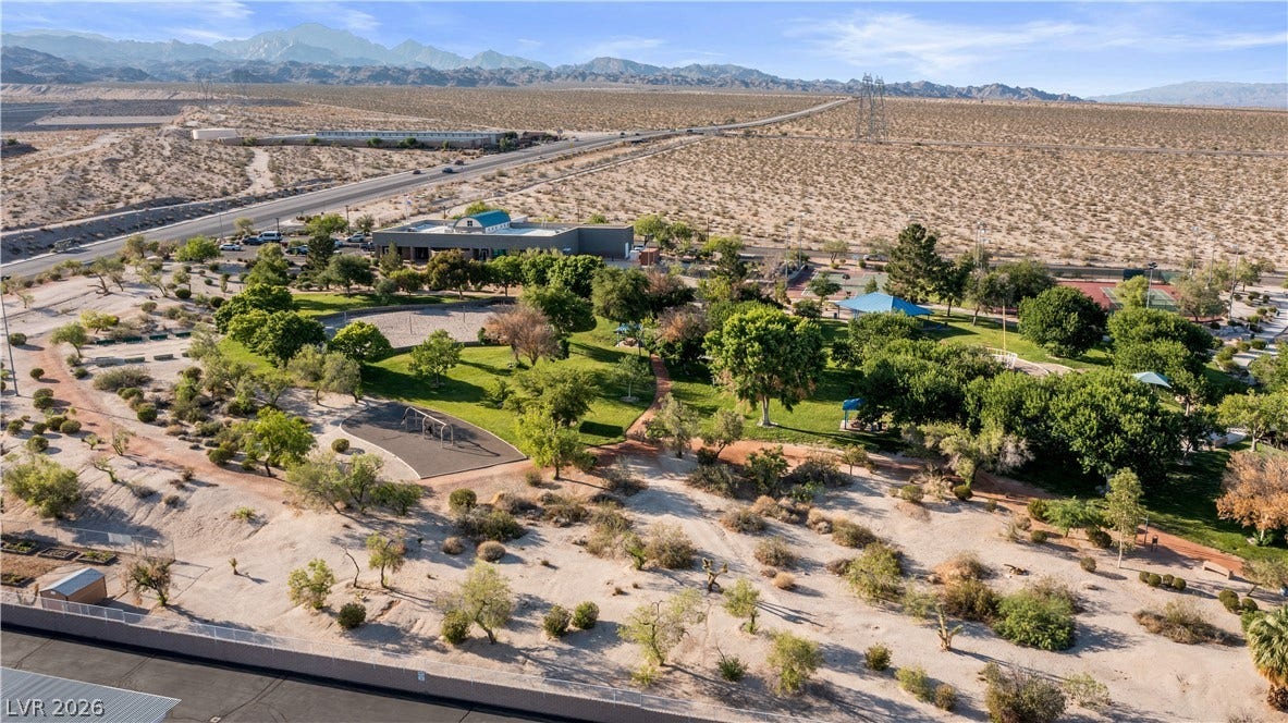 Aerial view of Public Park, right next to the community, featuring a mountainous background
