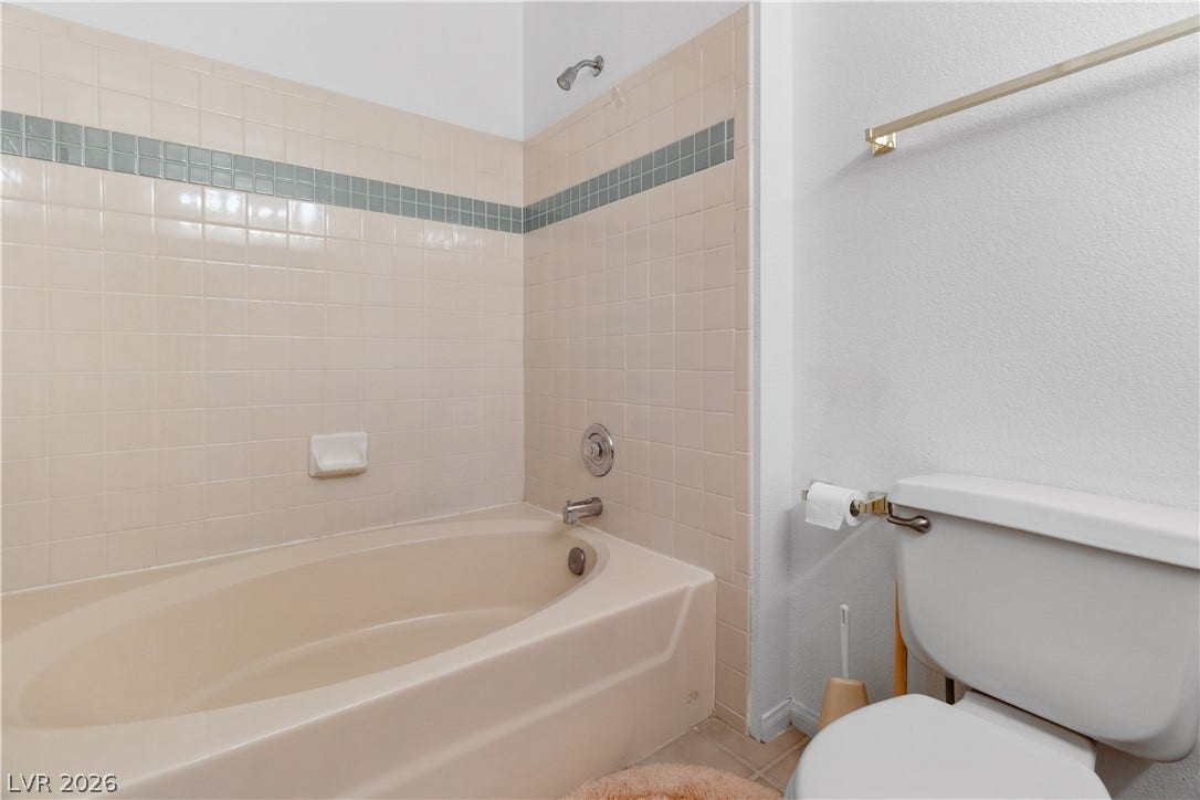 Primary Full bathroom with toilet and washtub / shower combination
