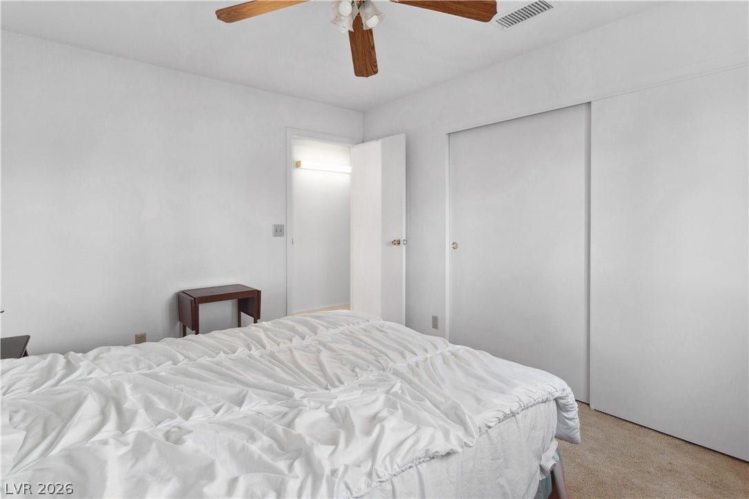 Third Bedroom with light carpet, ceiling fan, and a closet