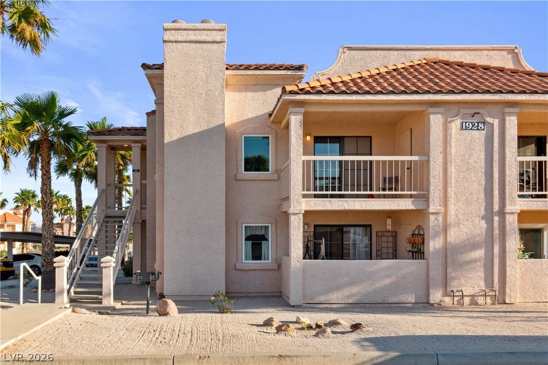 View of property with stairway