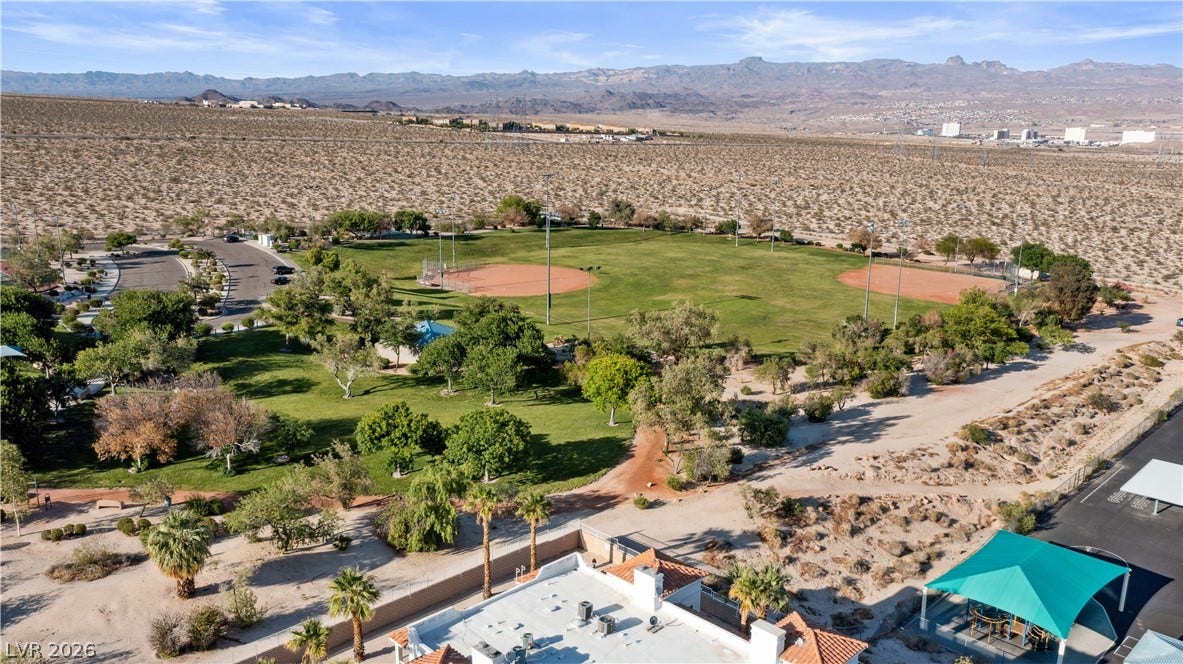 Aerial view of public park with a mountainous background