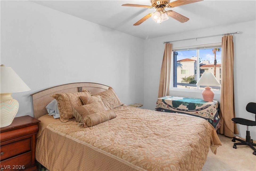 Carpeted Secondary bedroom with a ceiling fan
