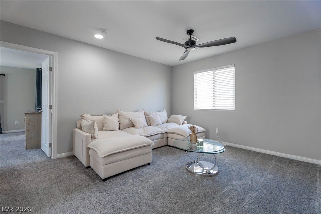 7061 Tilligerry Street, North Las Vegas, NV 89084 Plush wall-to-wall carpeting and clean architectural lines define this comfortable upstairs living space.