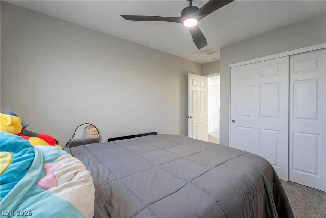 7061 Tilligerry Street, North Las Vegas, NV 89084 Plush wall-to-wall carpeting and neutral tones create a quiet, restful atmosphere in this room.