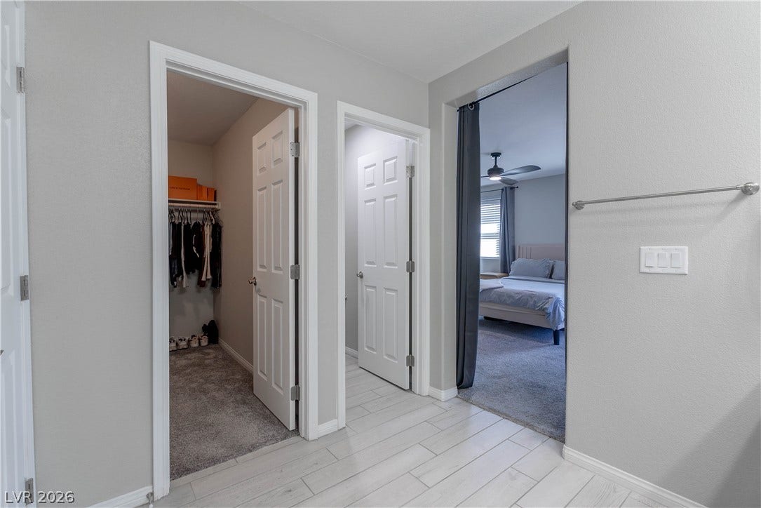7061 Tilligerry Street, North Las Vegas, NV 89084 An organized floor plan links the walk-in closet and adjoining rooms seamlessly.