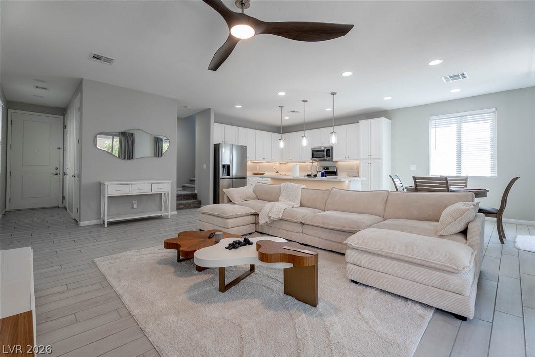 7061 Tilligerry Street, North Las Vegas, NV 89084 An open floor plan seamlessly connects the central living area to the adjacent kitchen.