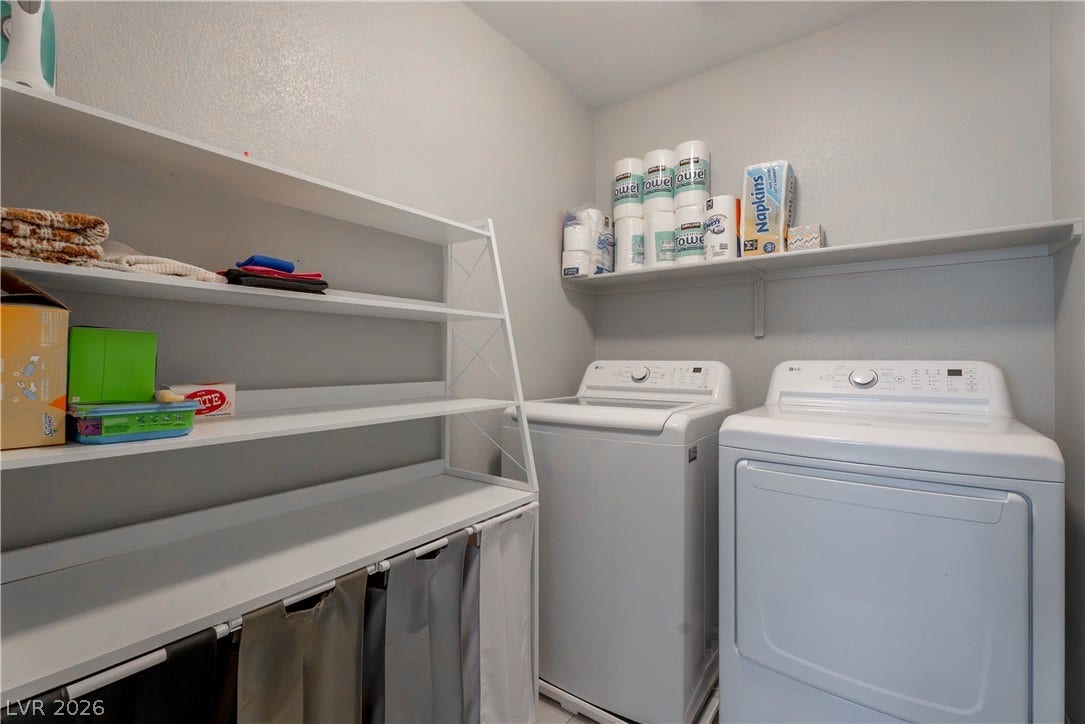 7061 Tilligerry Street, North Las Vegas, NV 89084 Shelving provides convenient organization options in this dedicated laundry space.