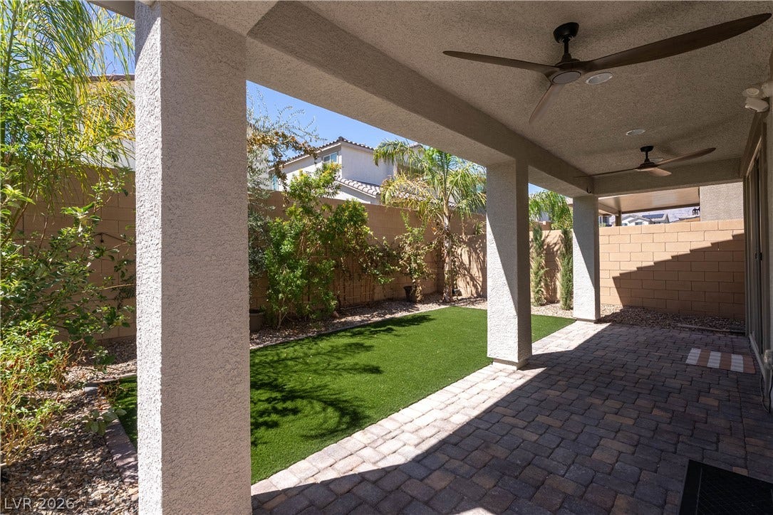 7061 Tilligerry Street, North Las Vegas, NV 89084 A spacious covered patio overlooks the manicured lawn and private backyard.