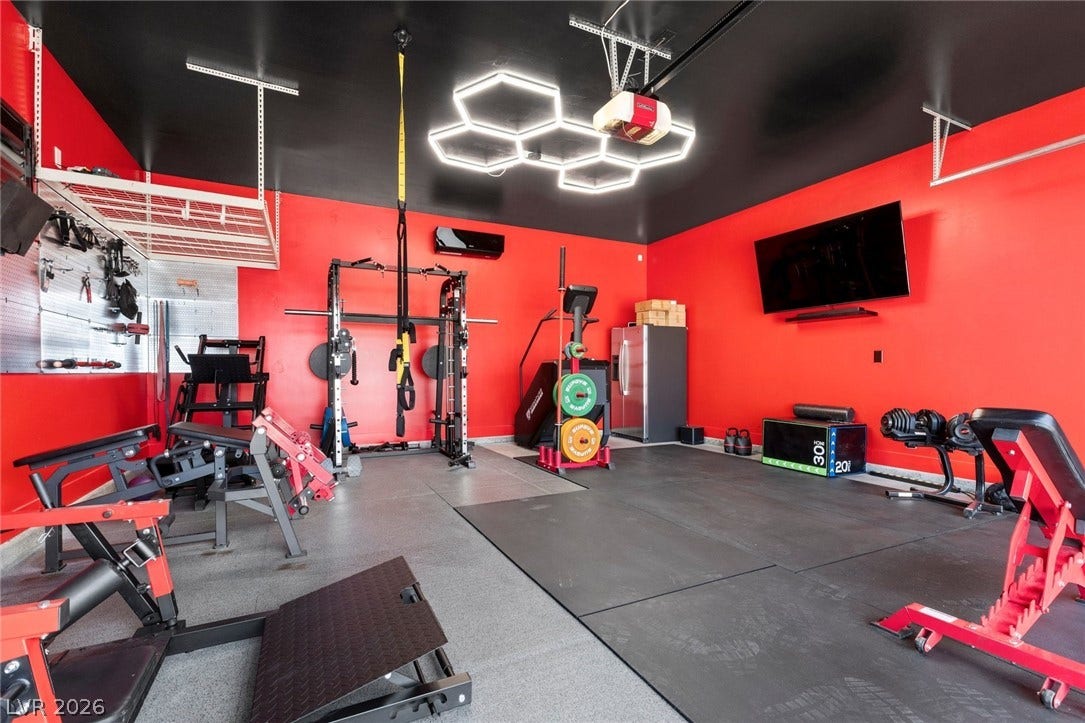 9841 W El Campo Grande Avenue, Las Vegas, NV 89149 Fitness enthusiast's dream, this dedicated garage gym boasts durable flooring and smart storage solutions.