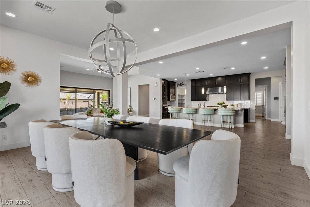 9841 W El Campo Grande Avenue, Las Vegas, NV 89149 An inviting open-concept dining area flows seamlessly into a well-appointed kitchen.