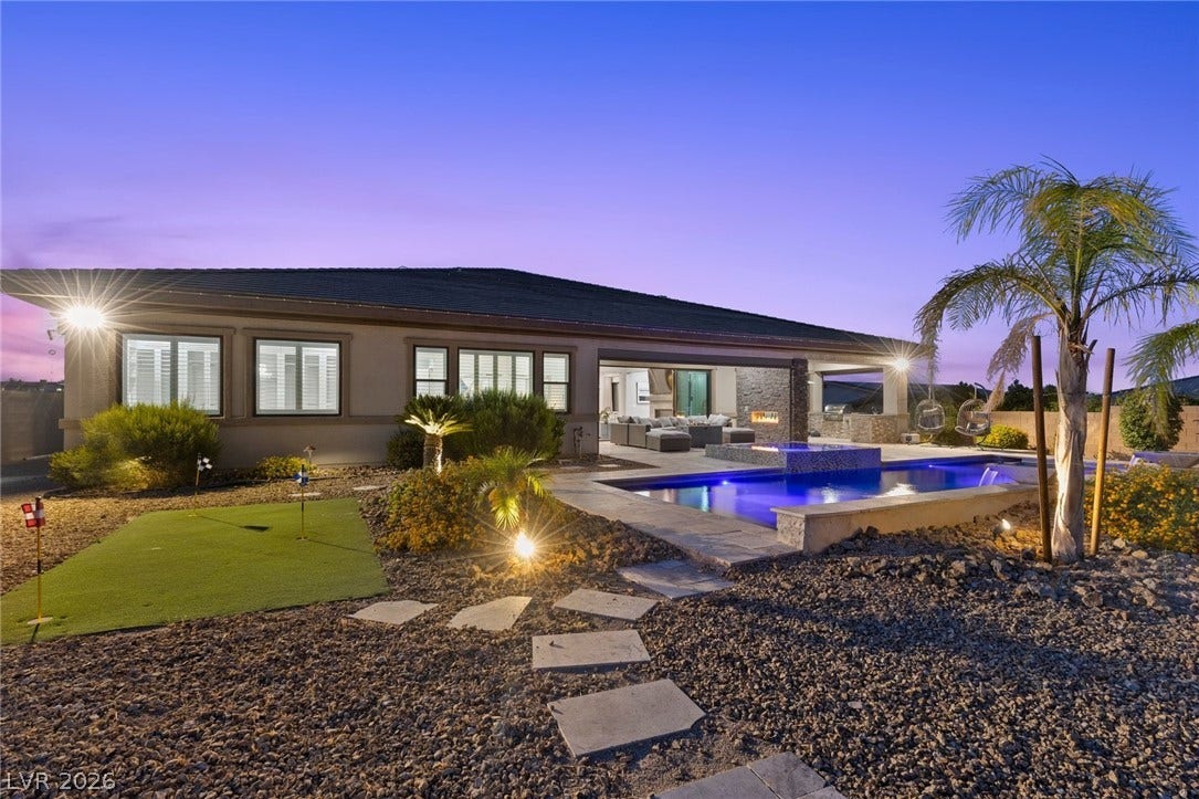 9841 W El Campo Grande Avenue, Las Vegas, NV 89149 An inviting backyard oasis with a pristine pool and a dedicated putting green.