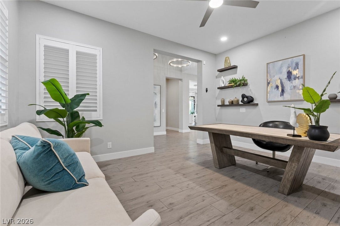 9841 W El Campo Grande Avenue, Las Vegas, NV 89149 Clean lines and a spacious layout create a productive and inviting home office environment.