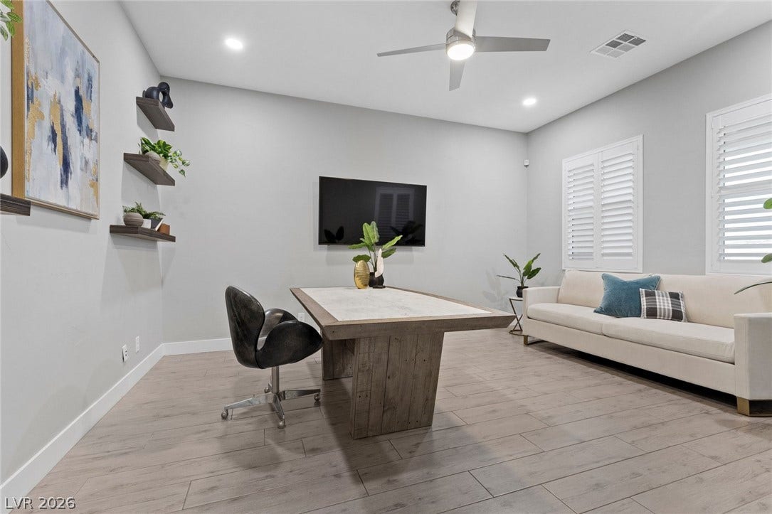9841 W El Campo Grande Avenue, Las Vegas, NV 89149 Clean lines and a spacious layout create an inviting atmosphere, perfect for work or relaxation.