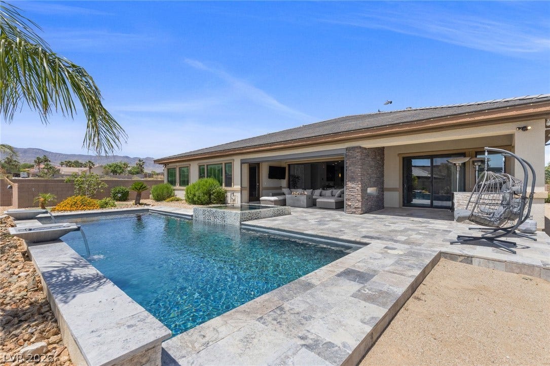 9841 W El Campo Grande Avenue, Las Vegas, NV 89149 An inviting pool area with a covered patio creates an ideal setting for outdoor enjoyment.