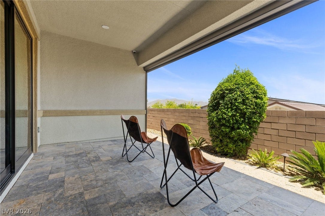 9841 W El Campo Grande Avenue, Las Vegas, NV 89149 An inviting covered patio offers a private outdoor retreat with scenic views.